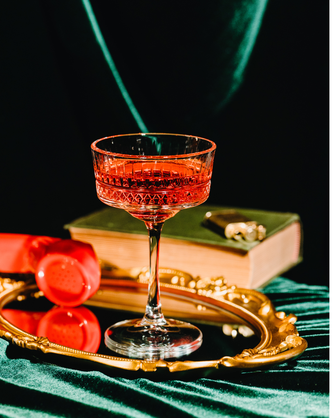 Premium service — red crystal glass on gold tray